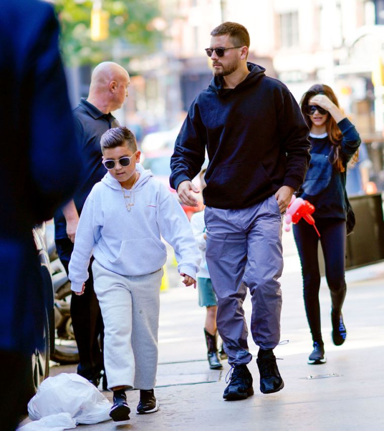 Mason leads the way while out to lunch with his parentals and siblings in New York City.