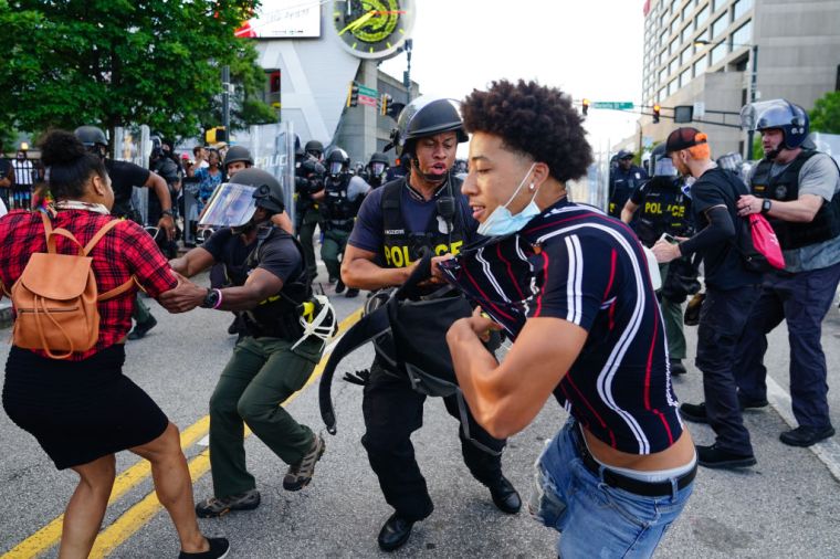 Police violently arresting demonstrators in Atlanta, GA.