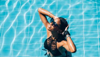 Young Black woman at resort pool