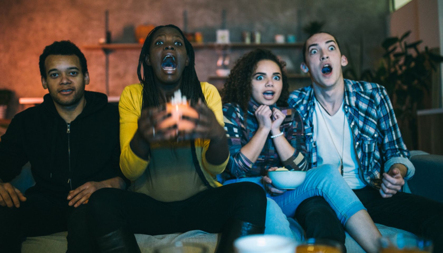 Scared friends watching horror