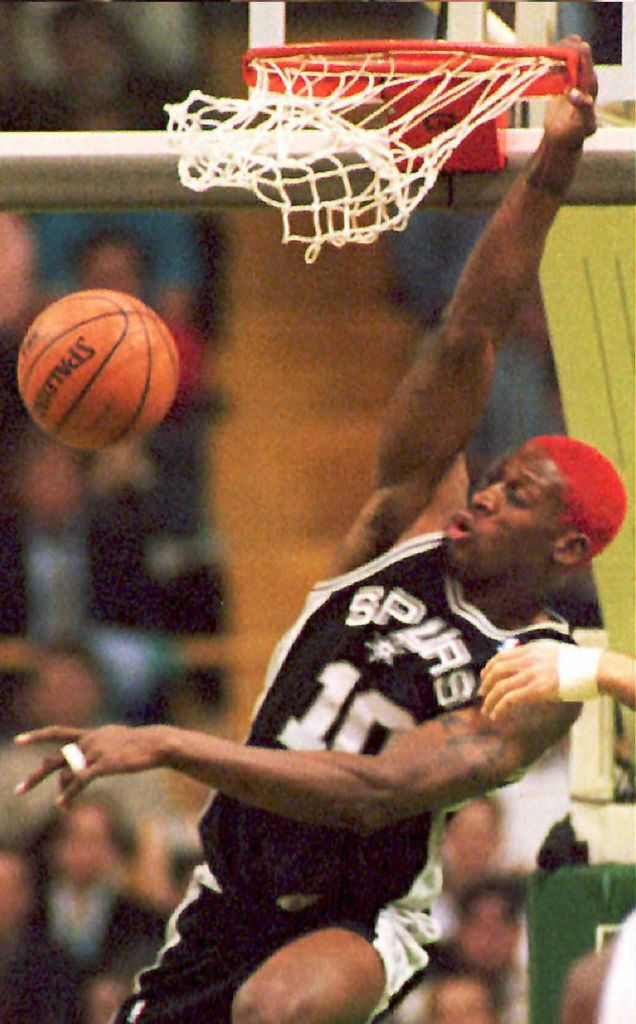 Dennis Rodman (#10) of the San Antonio Spurs slams