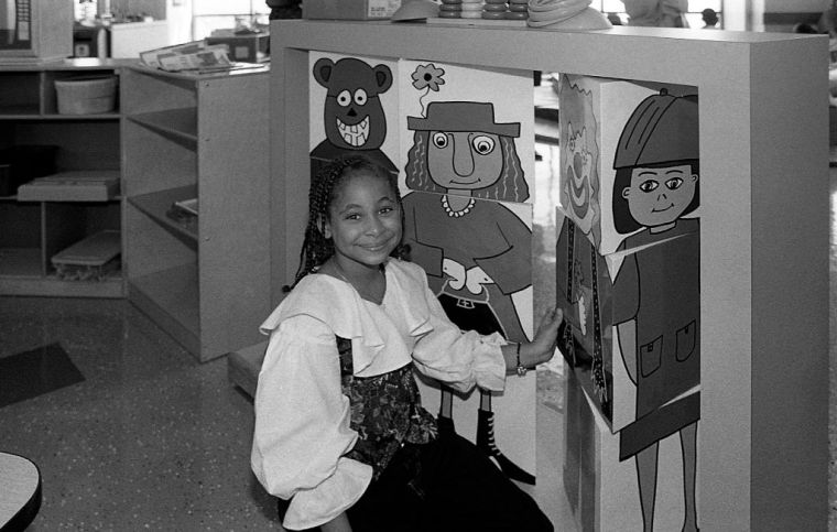 Raven takes a photo during her visit to La Rabida Children's Hospital in Chicago back in '93.