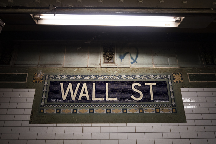 Wall Street sign in NYC train station