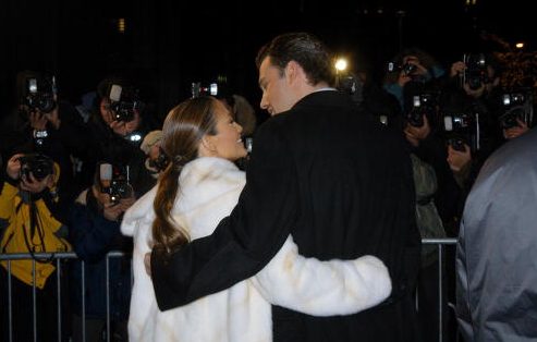 Ben Affleck and fiancee Jennifer Lopez embrace as they stand