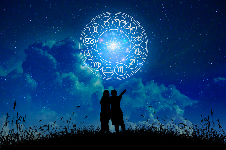Lovers stand in the stars zodiac signs inside of horoscope circle. Astrology in the sky with many stars and moons astrology and horoscopes concept