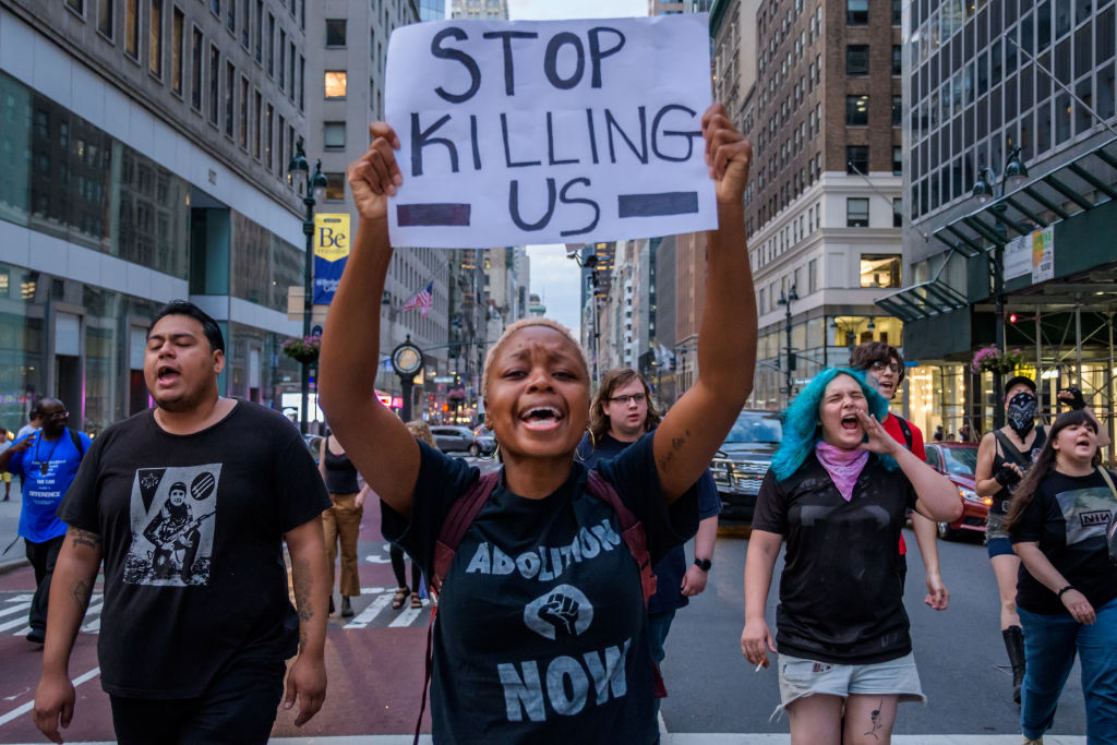 Protesters marching in the streets - Community organizations...