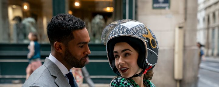 Emily In Paris production stills featuring Lucien Laviscount as Alfie and Lily Collins as Emily enjoying a romantic scooter ride