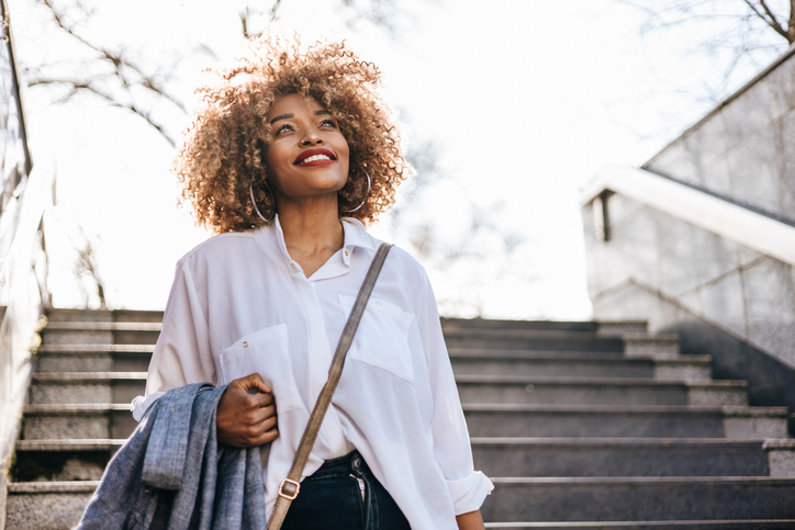 Beautiful black businesswoman on city street