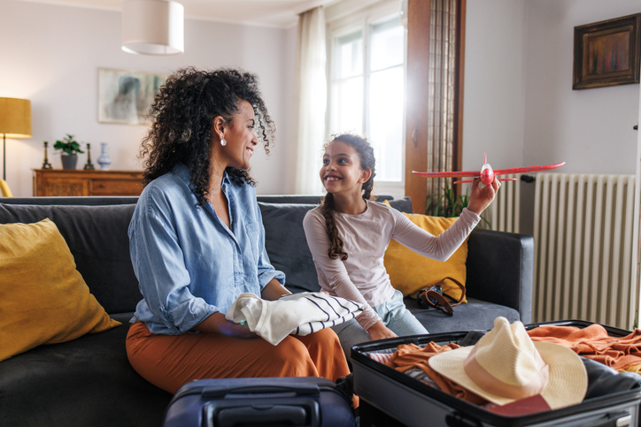 Mother and daughter packing. Anticipation. Summer holidays.