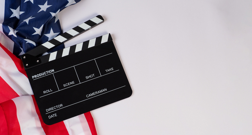 Clapper board and Usa flag on white background