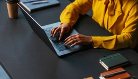 Businesswoman working on laptop in modern office